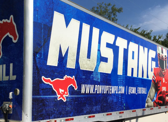 a sign on a trailer that reads Mustang and other Trailer Wraps in Carrollton, TX, Plano, TX, Frisco, TX, Dallas, TX, DFW, Lewisville, TX